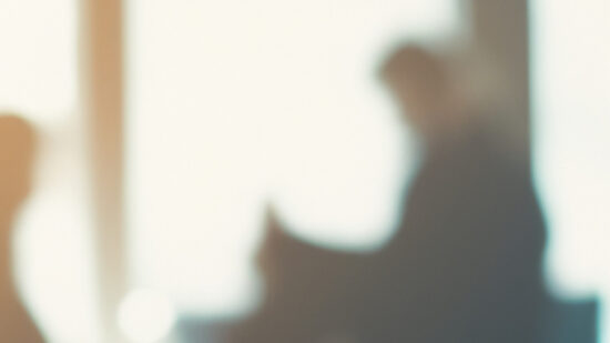 unrecognizable motion blurred business people in an office