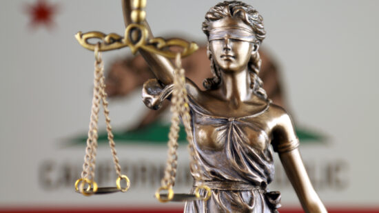 Symbol of law and justice with California State Flag. Close up.